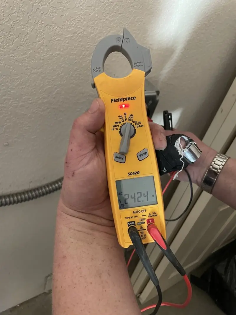 Voltage testing with clamp meter during Electrical Installation Services in St. Louis